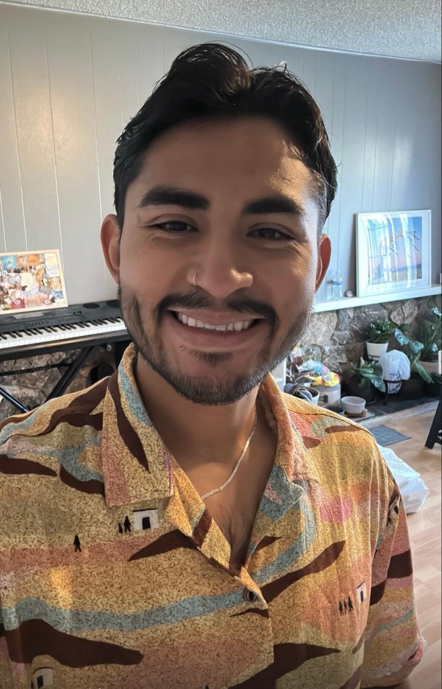 Cristian Barbosa smiling in his studio